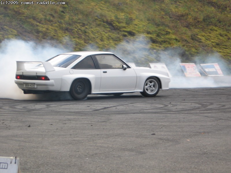 White Opel Manta burning tires