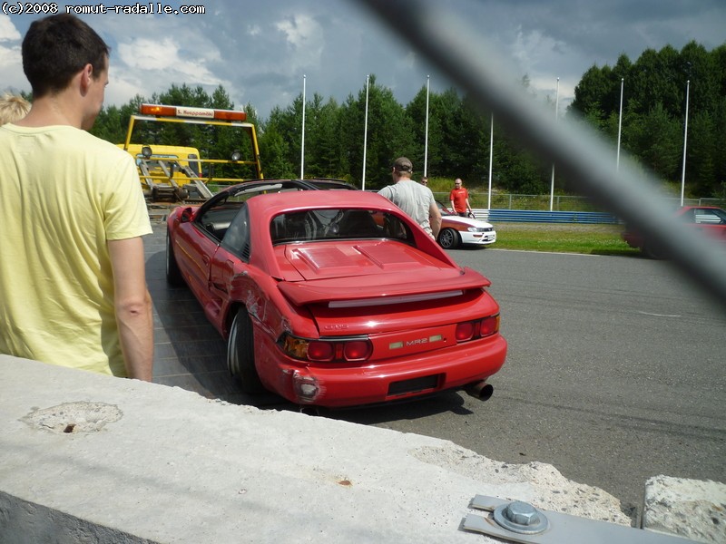 Red Toyota MR2 hit into wall